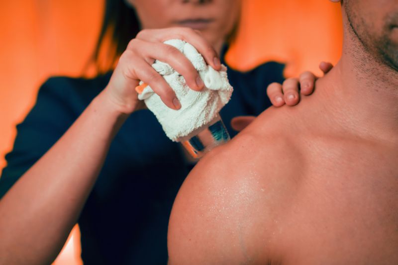 an image of a person applying heat to frozen shoulder
